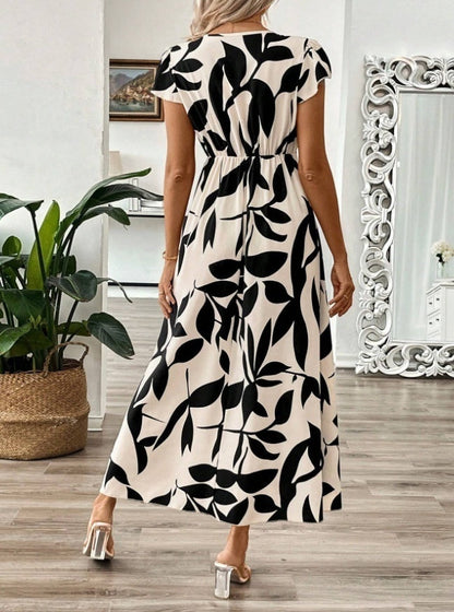 Elegancka sukienka maxi z nadrukiem i dekoltem w serek od Lidia Sek
